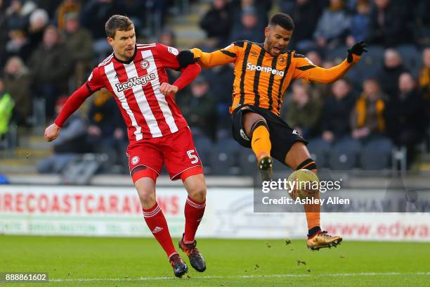 Hull City's Fraizer Campbell and Andreas Bjelland battle for control of the ball during the Sky Bet Championship match between Hull City and...