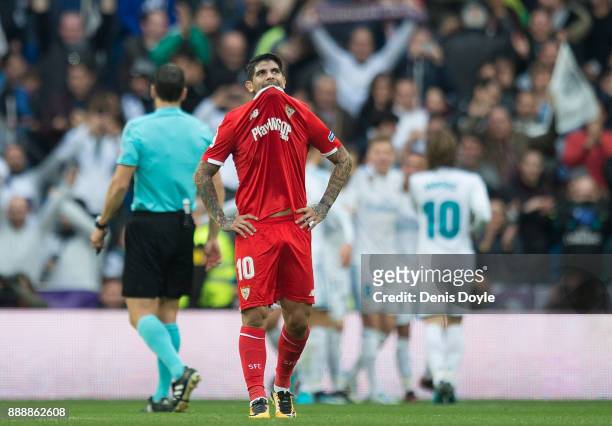 Ever Banega of Sevilla reacts after Real Madrid scored their 3rd goal during the La Liga match between Real Madrid and Sevilla at Estadio Santiago...