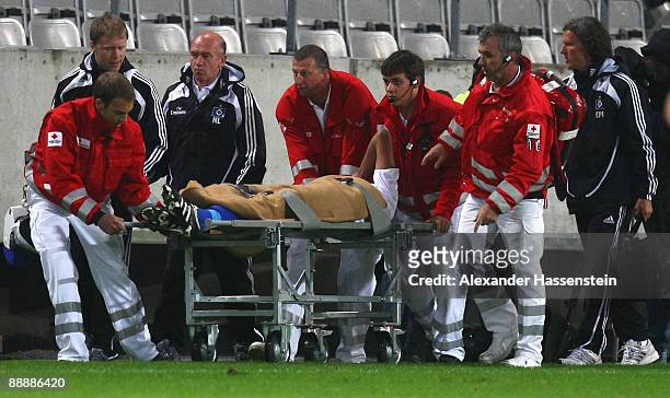 Alex Silva of Hamburg is carrying away on a stretcher after getting injured during the pre-season friendly match between Wacker Innsbruck and...