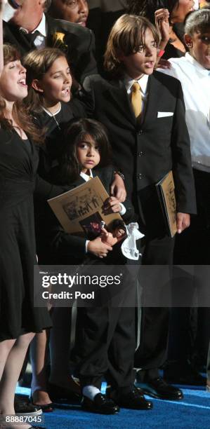 Michael Jackson's children Paris Jackson, Prince Michael Jackson II and Prince Michael Jackson stand on stage at the Michael Jackson public memorial...