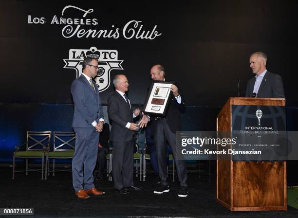 International Tennis Hall of Fame President Stan Smith presents the Los Angeles Tennis Club to Peter Lizotte , President of Los Angeles Tennis Club,...