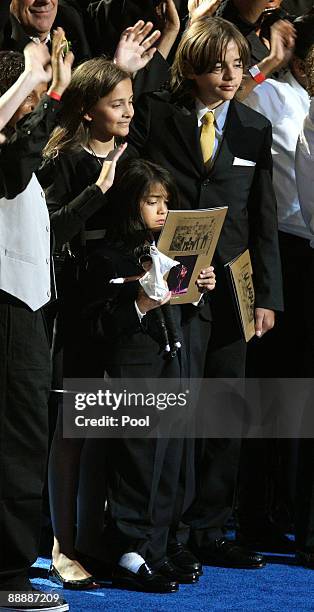 Michael Jackson's children Paris Jackson, Prince Michael Jackson II and Prince Michael Jackson stand on stage at the Michael Jackson public memorial...