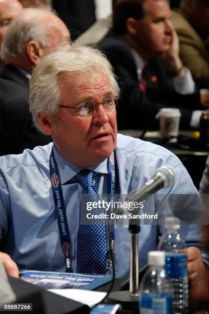 General Manager Glen Sather of the New York Rangers looks on from the Rangers draft table during the second day of the 2009 NHL Entry Draft at the...