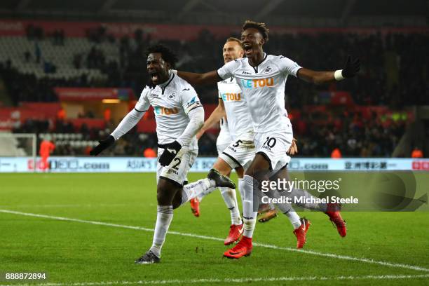 Wilfried Bony of Swansea City celebrates after scoring his sides first goal with Tammy Abraham of Swansea City and Mike van der Hoorn of Swansea City...