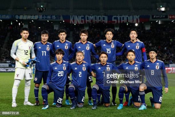 Players of Japan line up for team photos prior to the match of the EAFF E-1 Men's Football Championship between Japan and North Korea at Ajinomoto...