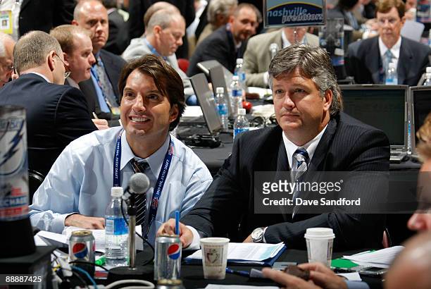 General Manager Brian Lawton and Director of Player Personell Jim Hammett of the Tampa Bay Lightning look on from the Lightning draft table during...