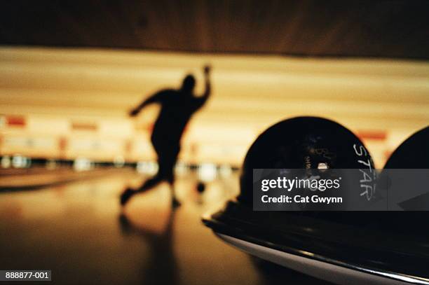 ten-pin bowling, competitor bowling, balls in foreground - bowling pin stock-fotos und bilder