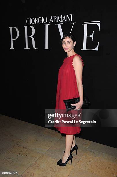 Actress Emmanuelle Beart poses as she arrives at the Giorgio Armani Prive Fashion Show as part of Paris Fashion Week Haute Couture A/W 2009/10 at...