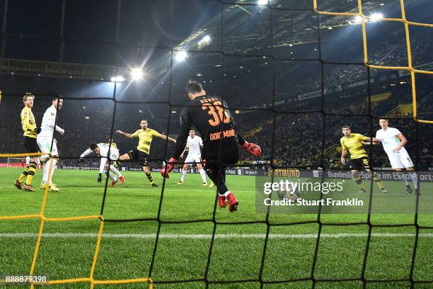 Theodor Gebre Selassie of Bremen scores a goal past goalkeeper Roman Buerki of Dortmund to make it 1:2 during the Bundesliga match between Borussia...