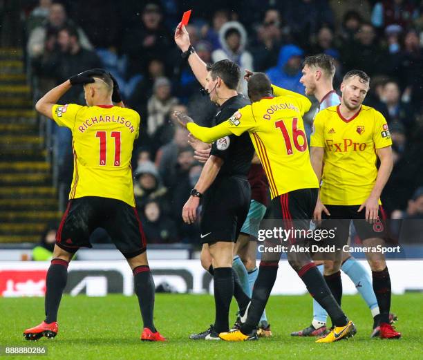 Referee Lee Probert shows Watford's Marvin Zeegelaar a straight red card during the Premier League match between Burnley and Watford at Turf Moor on...