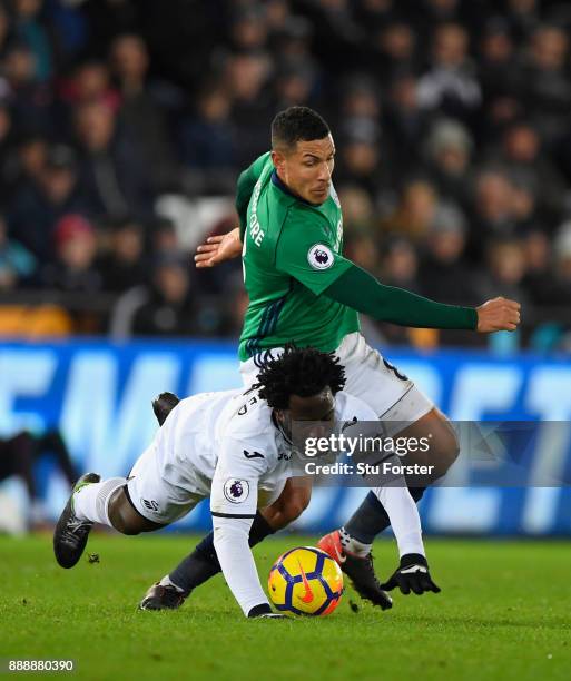 Player Jake Livermore challenges Wilfried Bony of Swansea during the Premier League match between Swansea City and West Bromwich Albion at Liberty...