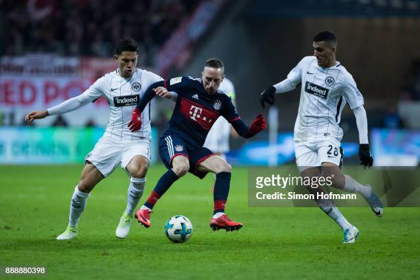 Franck Ribery of Muenchen is challenged by Aymen Barkok and Carlos Salcedo of Frankfurt during the Bundesliga match between Eintracht Frankfurt and...