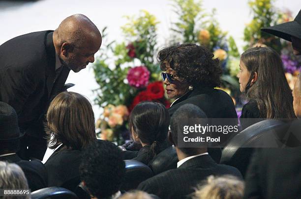 Motown records founder Berry Gordy is greeted by Michael Jackson's mother Katherine Jackson as she sits with Prince Michael, Prince Michael II and...