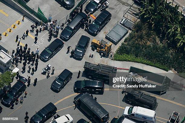 Fans gather outside the Staples Center as Michael Jackson's funeral procession leaves his public memorial service held at Staples Center on July 7,...