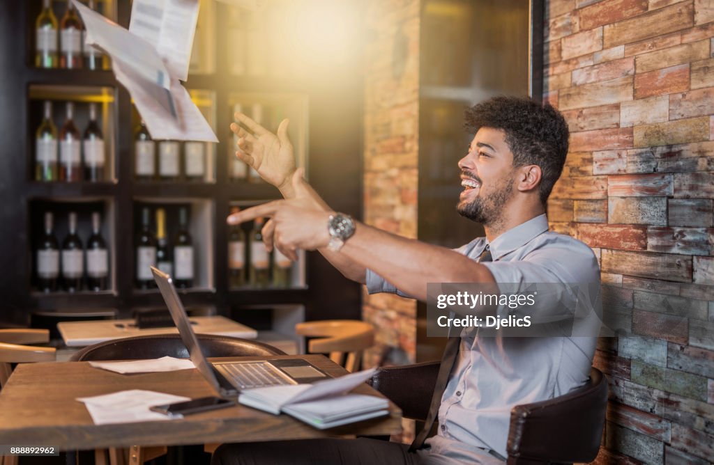 Happy African American businessman celebrating his success