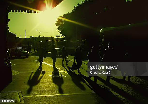 people walking on illuminated street at night  - ancine and car stock pictures, royalty-free photos & images