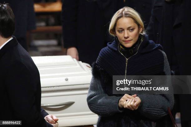 French actress Marion Cotillard pays her last respects during the funeral service of French musician Johnny Hallyday at La Madeleine Church in Paris...