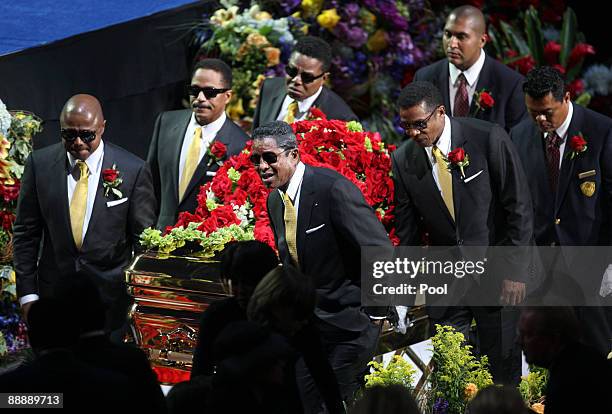 The Jackson brothers; Randy, Marlon, Tito, Jermaine and Jackie carry the casket containing the body of Michael Jackson during his public memorial...