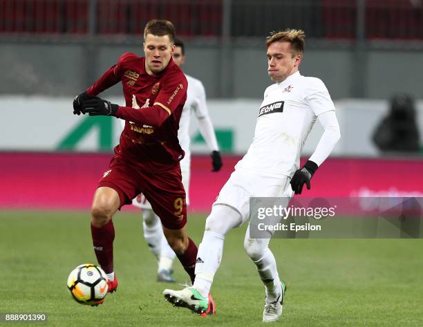 Maksim Kanunnikov of FC Rubin Kazan vies for the ball with Pavel Karasyov SKA Khabarovsk during the Russian Premier League match between FC Rubin...