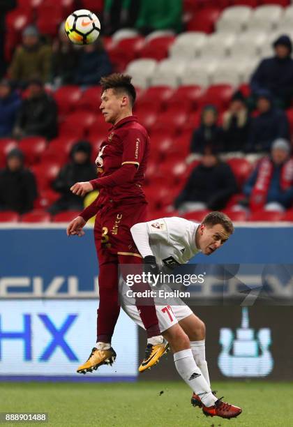 Elmir Nabiullin of FC Rubin Kazan vies for the ball with Konstantin Savichev SKA Khabarovsk during the Russian Premier League match between FC Rubin...