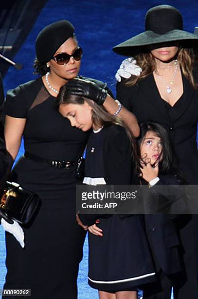 Janet Jackson comforts Michael Jakson's daughter Paris and son Prince Michael beside LaToya Jackson during the memorial service for Michael Jackson...