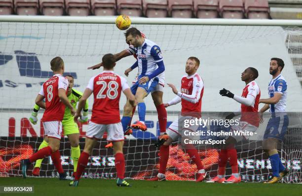 Wigan Athletic's Nick Powell beats Fleetwood Town's Nathan Pond to the ball and heads his sides first goal during the Sky Bet League One match...