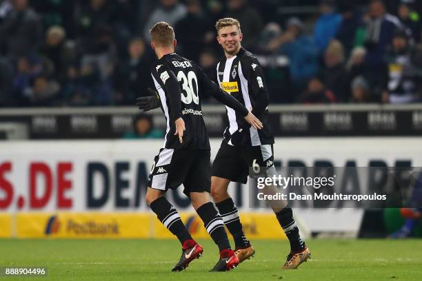 Christoph Kramer of Moenchengladbach celebrates with Nico Elvedi of Moenchengladbach after he scored a goal to make it 1:0 during the Bundesliga...