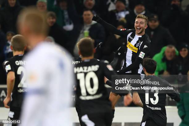 Christoph Kramer of Moenchengladbach jumps and celebrates after he scored a goal to make it 1:0 during the Bundesliga match between Borussia...