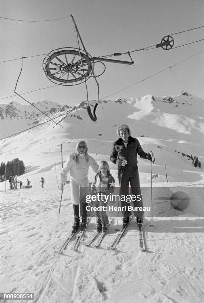 Johnny Hallyday with his wife Sylvie Vartan and his son David Hallyday on a ski trip, January 1974