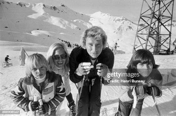 Johnny Hallyday, with his wife Sylvie Vartan and his son David Hallyday on a ski trip, January 1974
