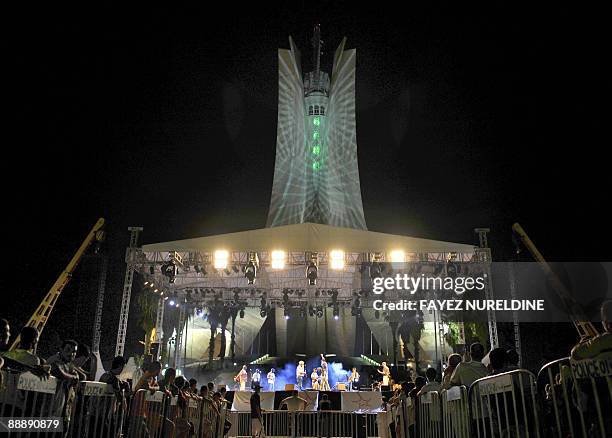 Algerians attend a music performance by an African band in front of the "unknown soldier" memorial during the third day of the second Pan-African...