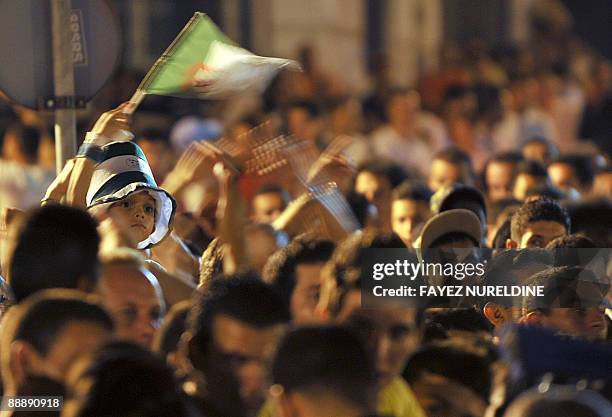 Algerians attend a music rally for an African traditional dance and music performance in front of the "Grande Poste" of Algiers City during the third...