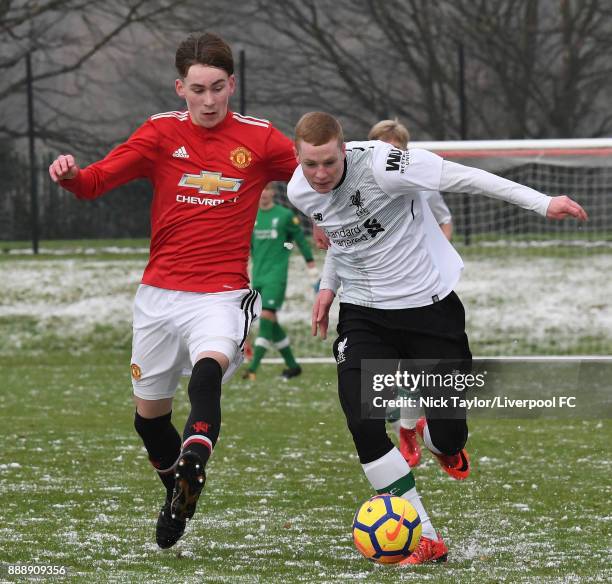 Glen McAuley of Liverpool and James Garner of Manchester United in action during the Manchester United v Liverpool U18 Premier League game at The...