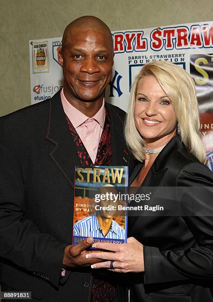 Darryl Strawberry and wife Tracy Strawberry pose for picture during Darryl Strawberry's "Straw: Finding My Way" book release party at Hawaiian Tropic...