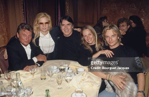 David Hallyday with his parents Johnny Hallyday and Sylvie Vartan, his wife Estelle Lefebure and stepfather Tony Scotti, after his concert at the...