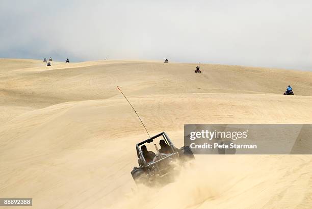 off road vehicles at pismo beach dunes.. - pismo beach stock pictures, royalty-free photos & images