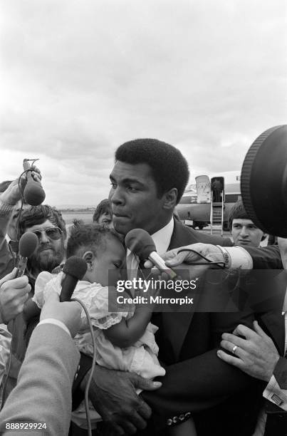 Muhammad Ali arrives at Teesside Airport with his family. July 1977.