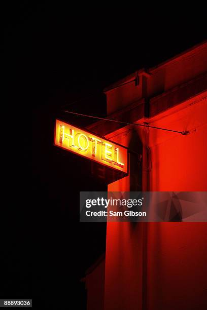 neon hotel sign - ominous stock pictures, royalty-free photos & images