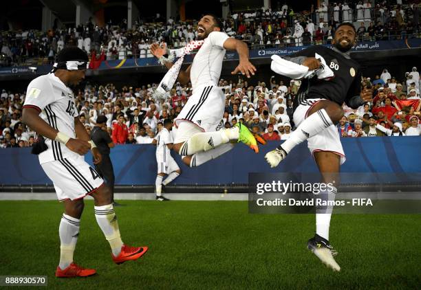 Ahmed Rabia, Salim Rashid and Salim Ali of Al-Jazira celebrate after the FIFA Club World Cup match between Al Jazira and Urawa Red Diamonds at Zayed...