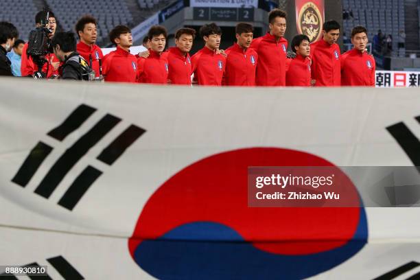 Players of South Korea line up for team photos prior to the match of the EAFF E-1 Men's Football Championship between South Korea and China at...