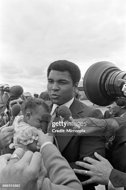 Muhammad Ali arrives at Teesside Airport with his family. July 1977.