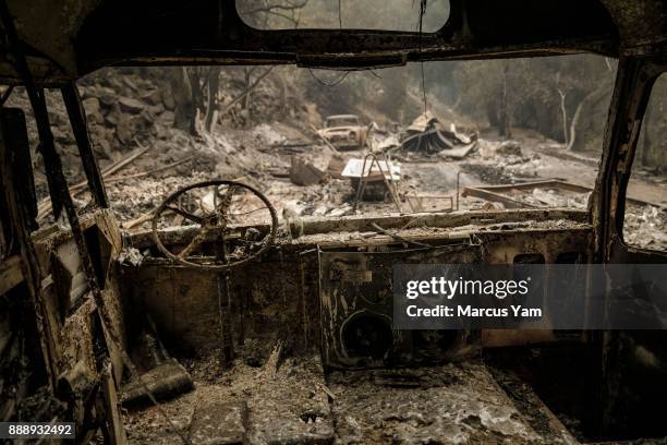 The remnants of a burnt out bus after brush fire swept through residential neighborhoods on Maripoca Highway near Ojai, Calif., on Dec. 8, 2017.