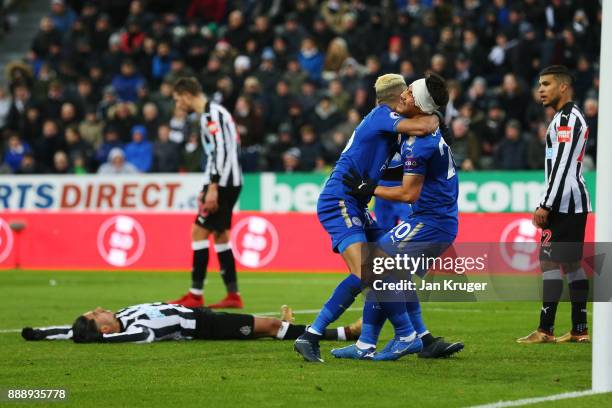 Shinji Okazaki and Riyad Mahrez of Leicester City celebrate after Ayozi Perez of Newcastle United scores an own goal during the Premier League match...