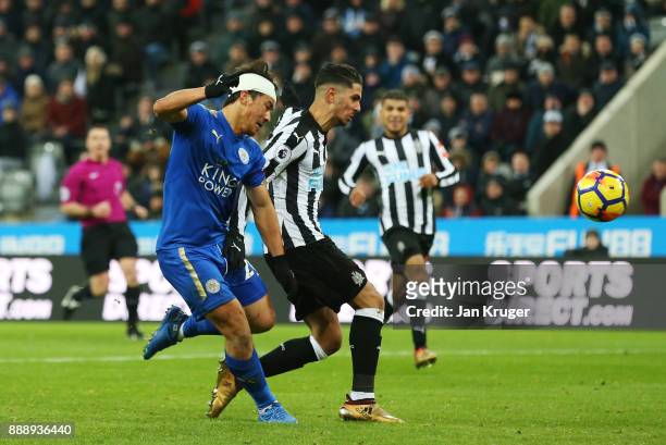 Ayozi Perez of Newcastle United scores an own goal under pressure from Shinji Okazaki of Leicester City during the Premier League match between...