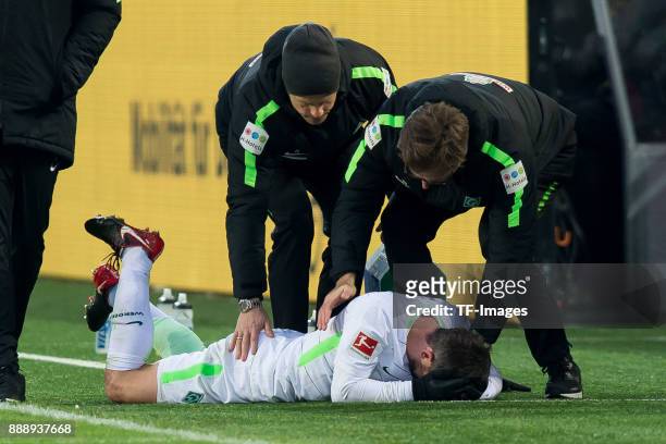 Fin Bartels of Bremen receives medical help during the Bundesliga match between Borussia Dortmund and SV Werder Bremen at Signal Iduna Park on...