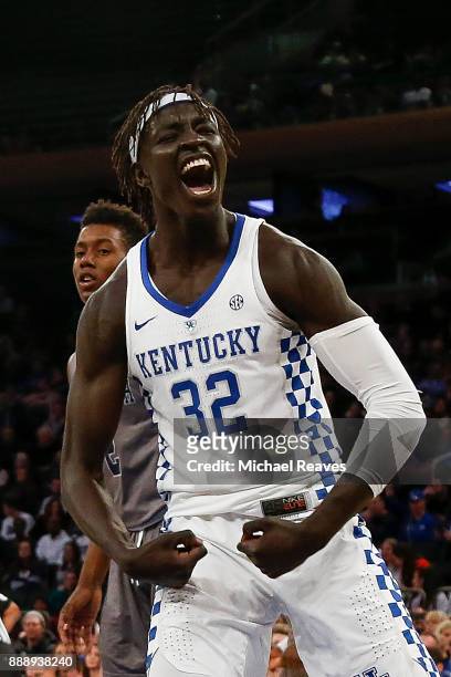 Wenyen Gabriel of the Kentucky Wildcats reacts after a dunk against the Monmouth Hawks during the second half at Madison Square Garden on December 9,...