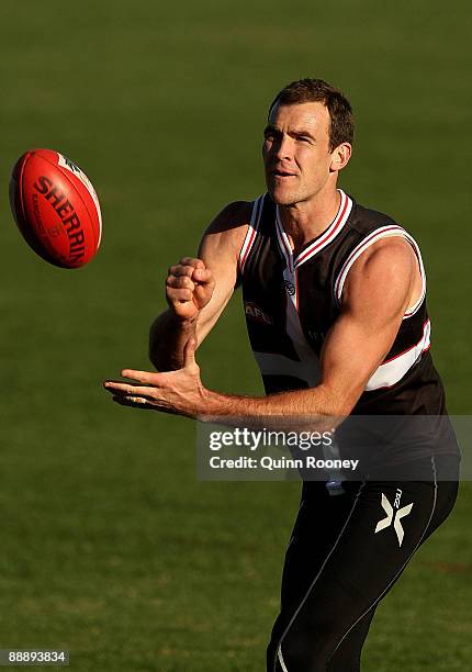 Steven King of the Saints handballs during a St Kilda Saints AFL training session held at Linen House Oval on July 8, 2009 in Melbourne, Australia.