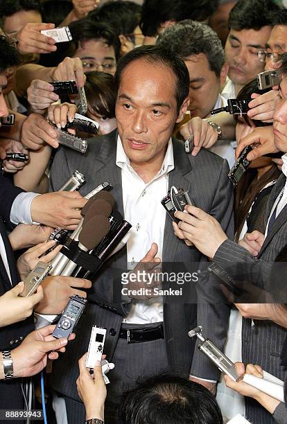 Miyazaki Prefecture Governor Hideo Higashikokubaru is surrounded by reporters after the meeting with Makoto Koga, Liberal Democratic Party Chairman...