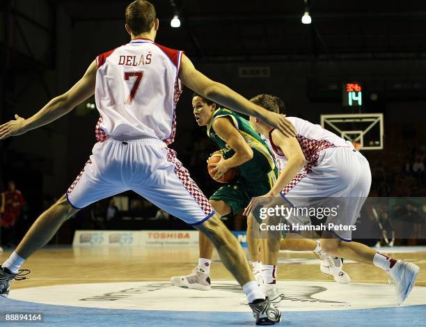 Jorden Page of Australia looks to get past Mario Delas of Croatia during the U19 Basketball World Championships match between Australia and Croatia...