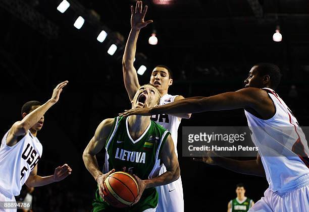 Adomas Drungilas of Lithuania is surrounded by strong United States defence from Seth Curry, Terrico White and Howard Thompkins during the U19...